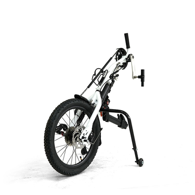 hand cranked wheelchair trailer with electric assistance and manual wheelchair front
